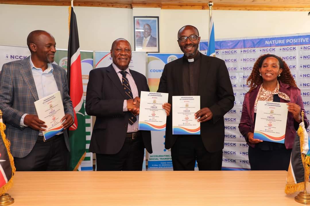 Kitui governor Dr Julius Malombe and head of NCCK display signed