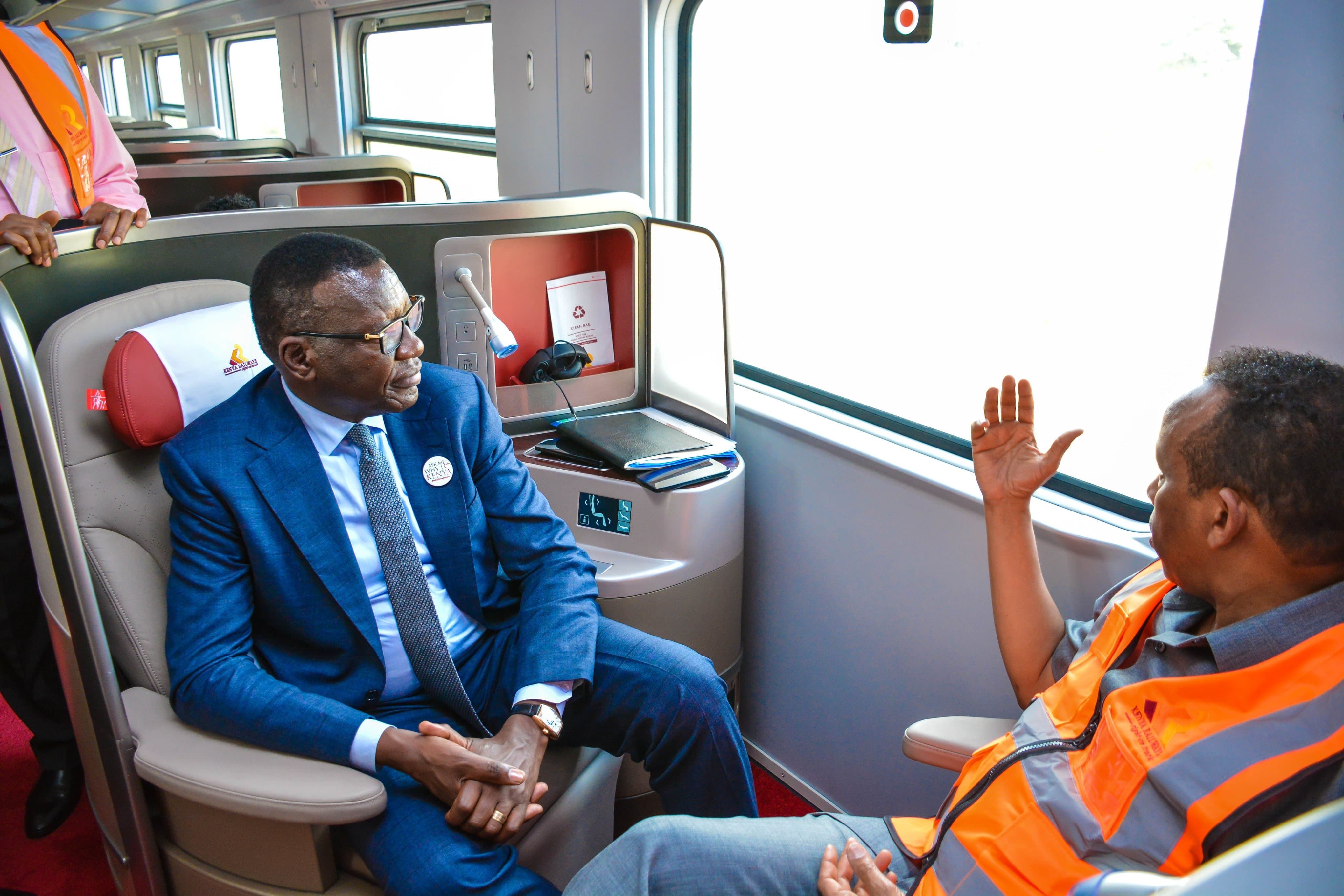 Roads and Transport Cabinet Secretary Davis Chirchir oboarding the Madaraka Express Passenger Service Train 