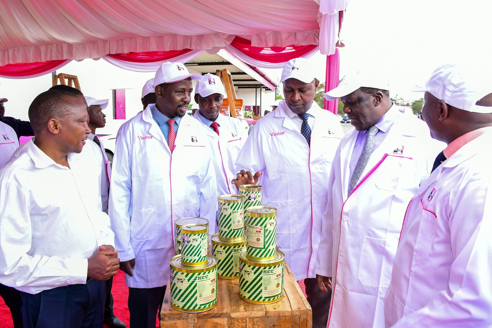 Cooperatives and MSMEs CS Wycliffe Oparanya (2nd left) and his PS Patrick Kilemi (centre) looking at some of the products manufactured by the New KCC.