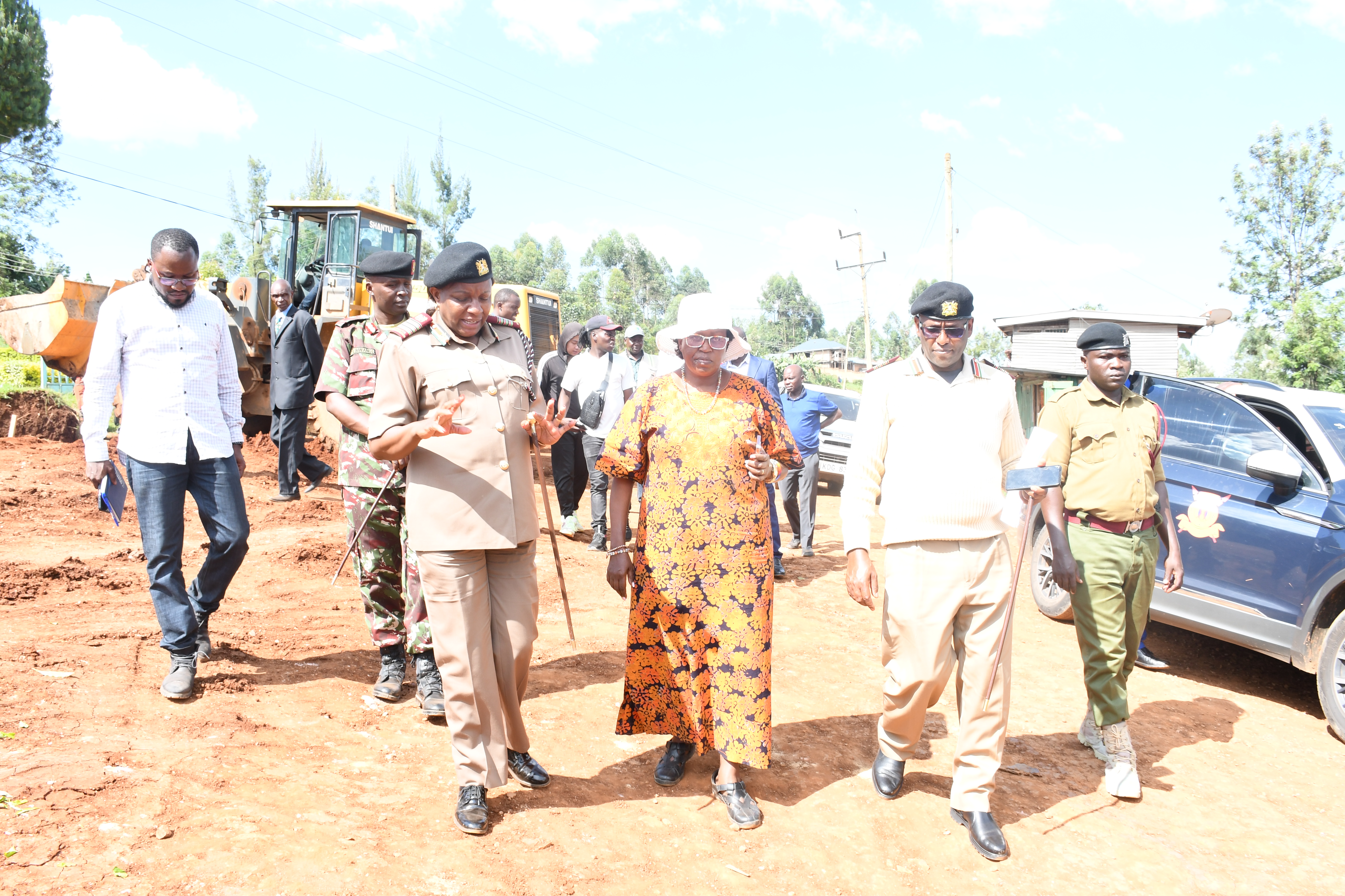 Principal Administrative Secretary at the office of the Prime Cabinet secretary, Ms. Juliana Yiapan (middle in hat) Inspecting completion status of an in-patient block of Keroka.