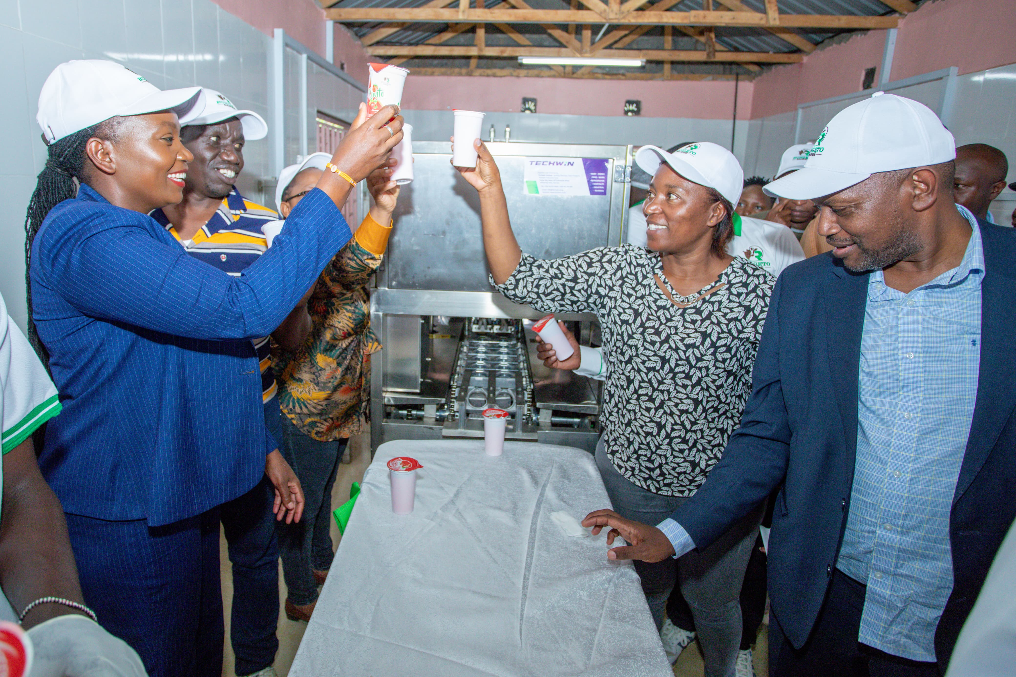 County Executive Committee member (CECM) for Finance and Economic Planning Jackline Njogu together with County Executive Committee Member (CECM) for Agriculture, Livestock, Veterinary and Fisheries Dr. John Gachara celebrating Runto yogurt at Rungeto farmers’ cooperative.