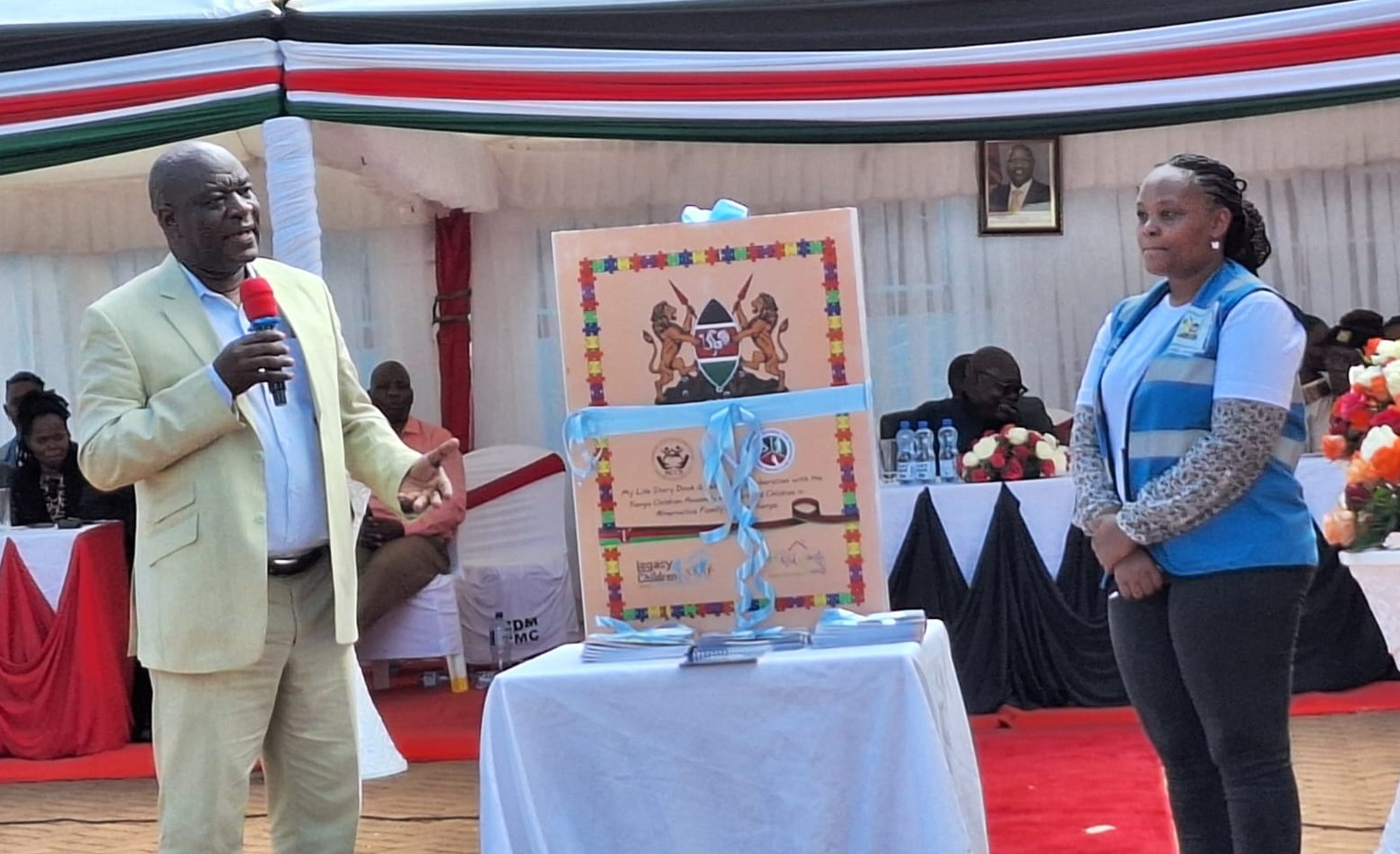 Head of Alternative Family Care Lloyd Isadia leads in launching a foster care reform report at Catholic Diocese of Murang’a grounds.