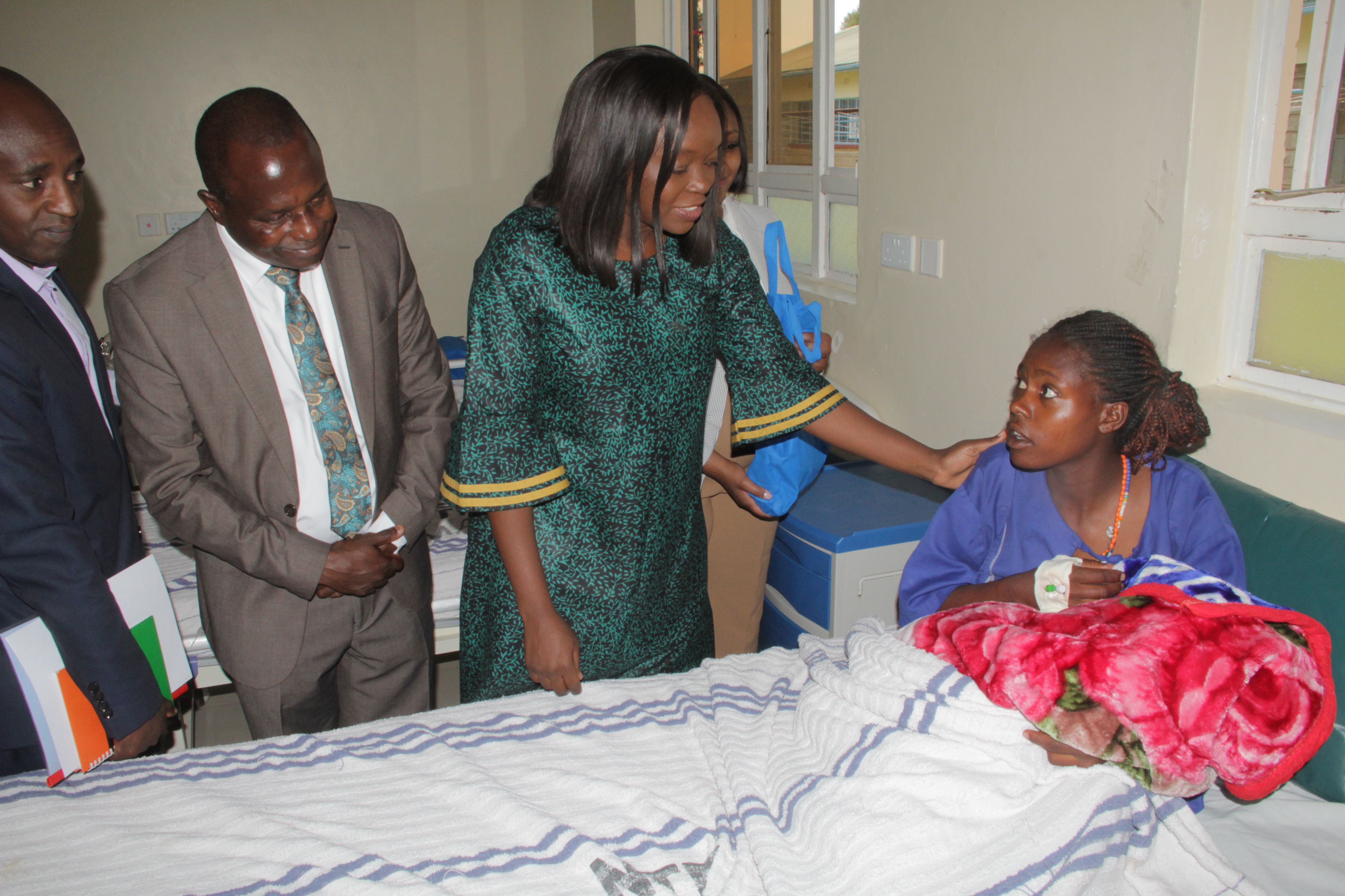 Cabinet Secretary for Health Deborah Barasa (in green)  speaking to a new mother at the Nanyuki teaching  and Referral Hospital where she had an official visit on  Tuesday, February 4, 2025.She urged for the registration  of Social Health Insurance Fund (SHIF)