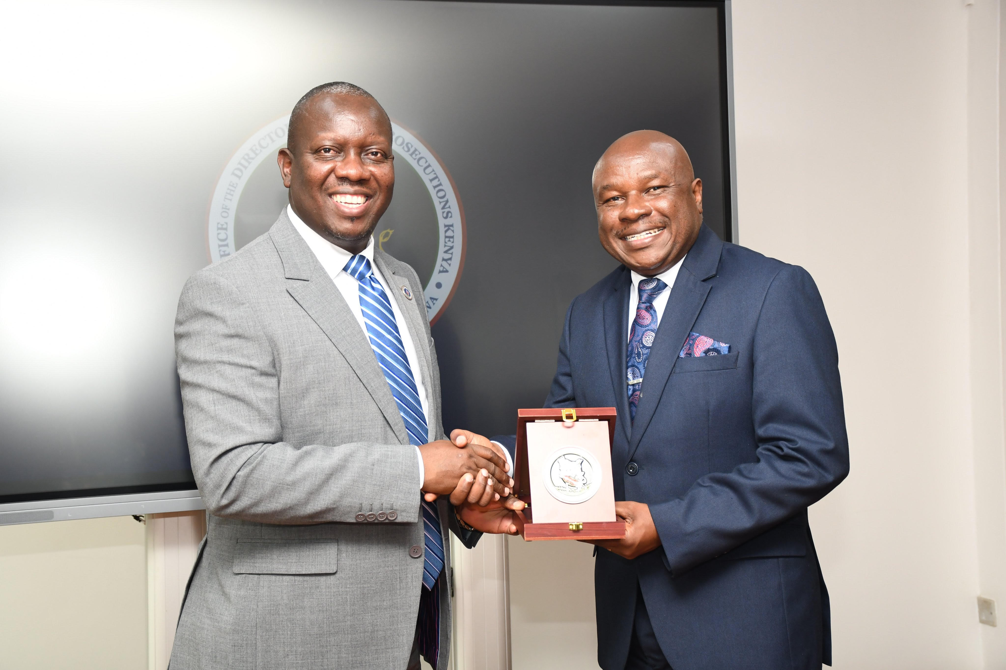 Labour Principal Secretary Shadrack Mwadime and  Director of Public Prosecutions (DPP) Renson Igonga  during a meeting to discuss how to enforce labour laws.  Photo/Catherine Kamau