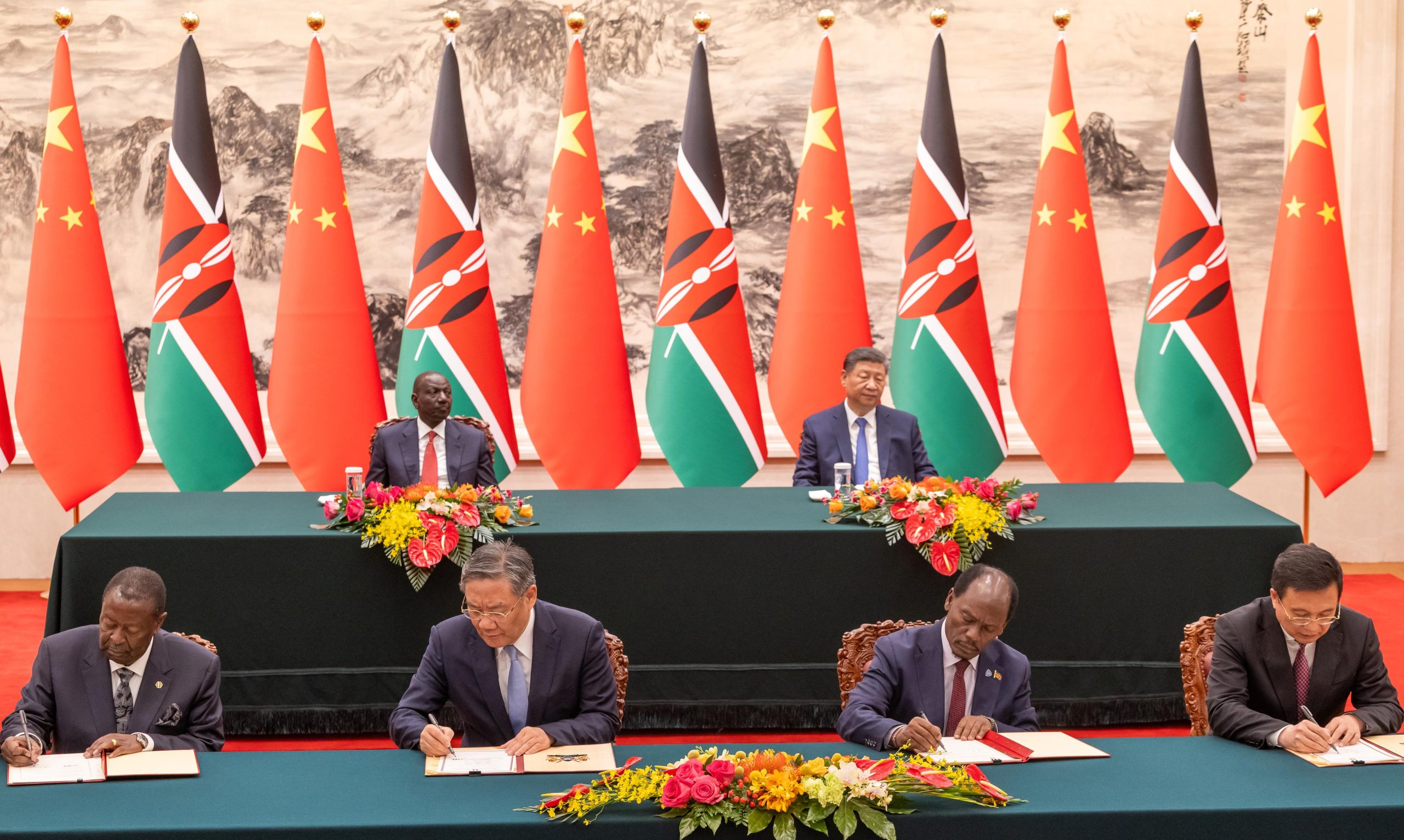 Kenya and China government officials signing documents on bilateral cooperation between the two countries in the presence of President William Ruto and his Chinese counterpart Xi Jinping in Beijing. Photo: PCS.