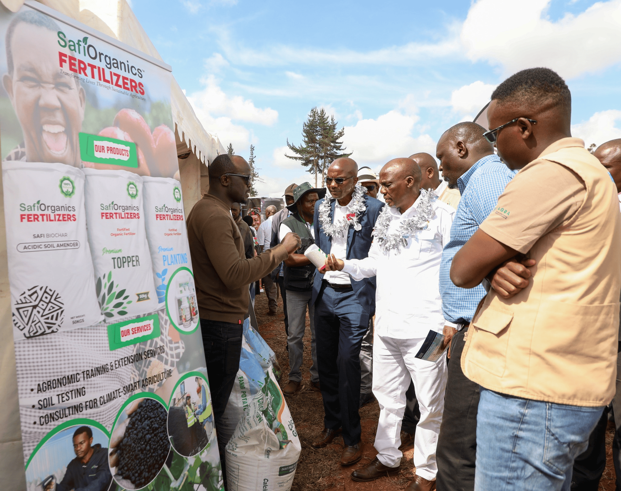 State Department for Agriculture and Livestock Principal Secretary  Dr Paul Ronoh (third right) and Nakuru Deputy Governor Dr David  Kones (Fourth left) during a meeting with potato farmers. He  affirmed that the Government is committed to implementing the  Irish Potato Regulations 2019 that compels traders to package  the crop in 50-kilogram bags