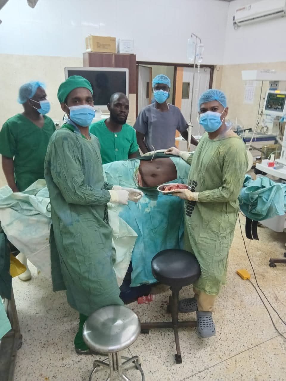Doctors and other medical team conducting a surgery on a 65-yearold patient diagnosed with renal cell carcinoma (cancer of the right kidney) at King Fahd Hospital in Lamu County