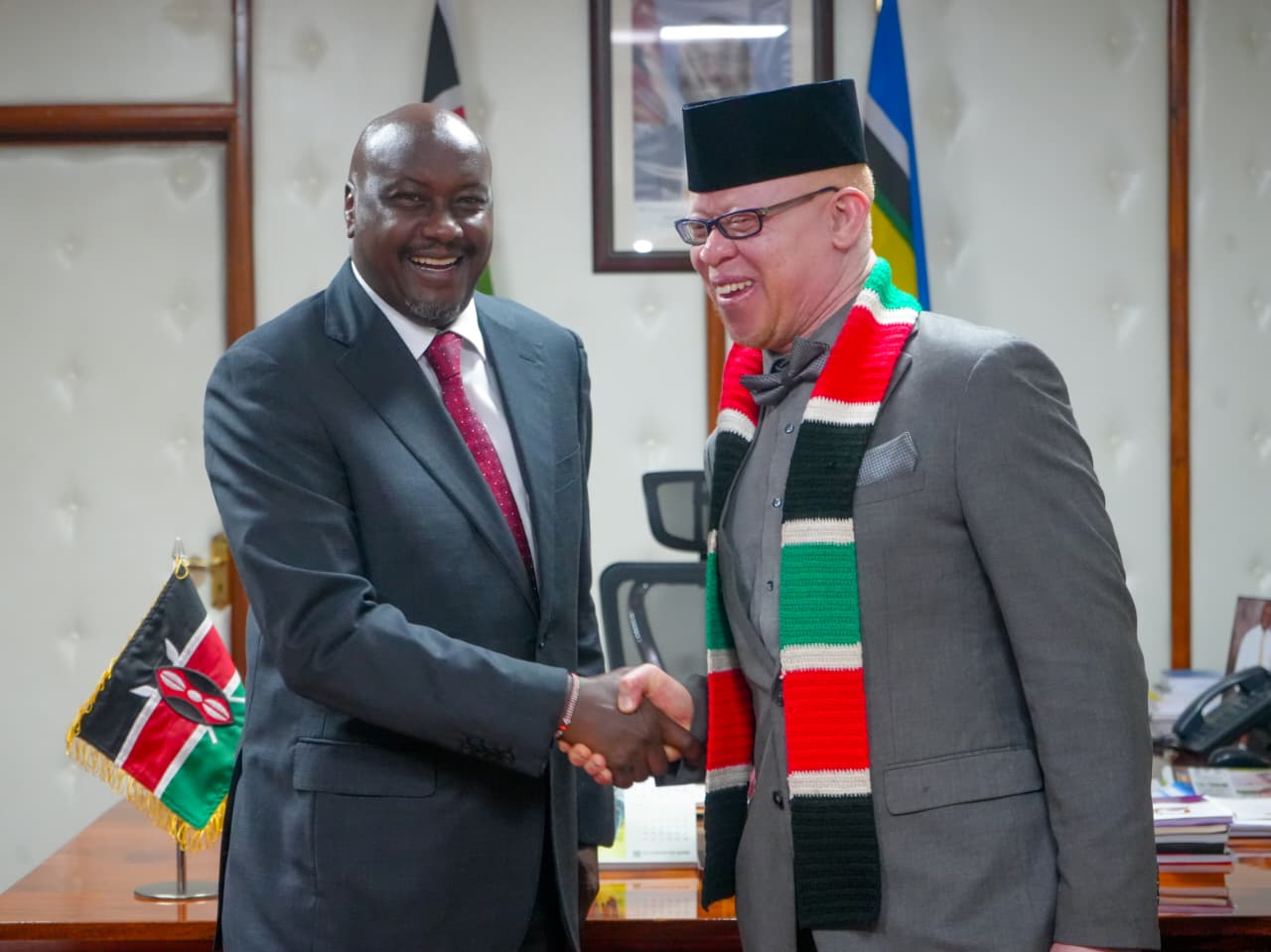 Deputy Head of the Public Service, Amos Gathecha and Government Spokesperson, Dr. Isaac Mwaura, engage during a meeting on government communication at Harambee House