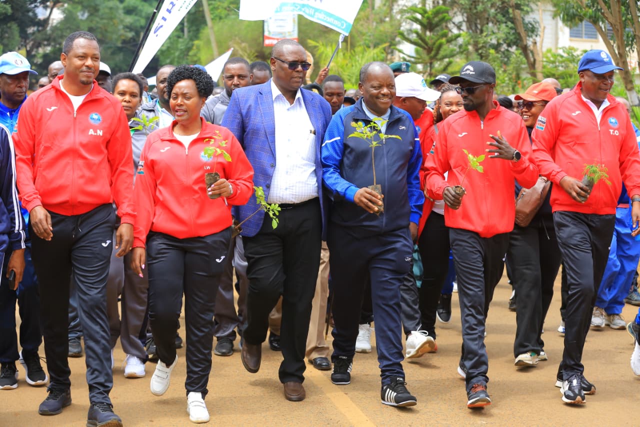Staff from various water companies participate in a walk during the opening ceremony of the Water Companies Sports Organization (WASCO) games at Gusii Stadium in Kisii. 