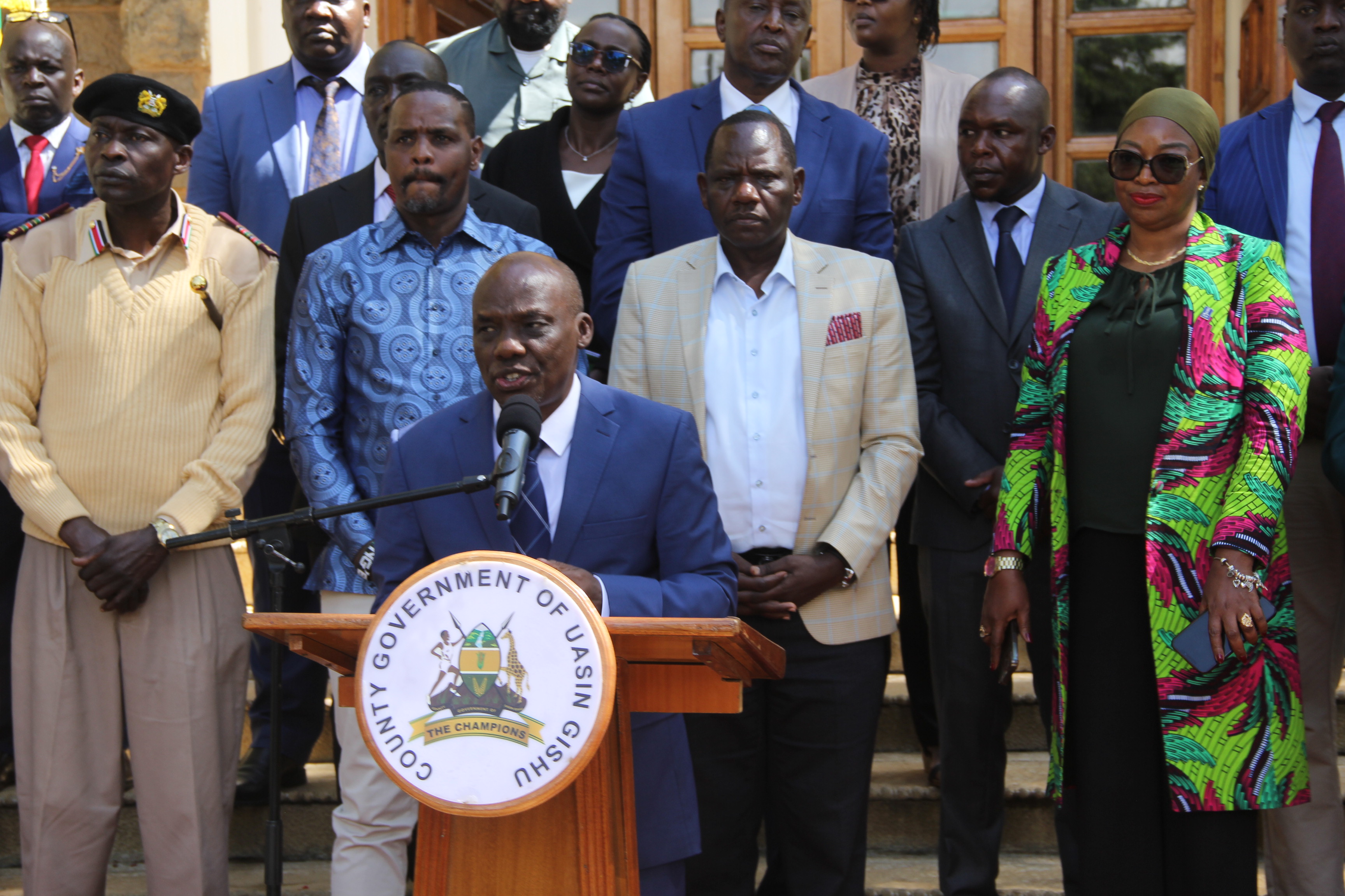 The Principal Secretary for Agriculture Dr. Kipronoh Ronoh Paul speaking in a press briefing flanked from back left; Uasin Gishu DCC Reuben Ogeda, Environment and Climate Change PS Dr. Festus Ng’eno, Governor Jonathan Bii Chelilim and Mariatu Kamara, International Fund for Agricultural Development (IFAD) Country Director.