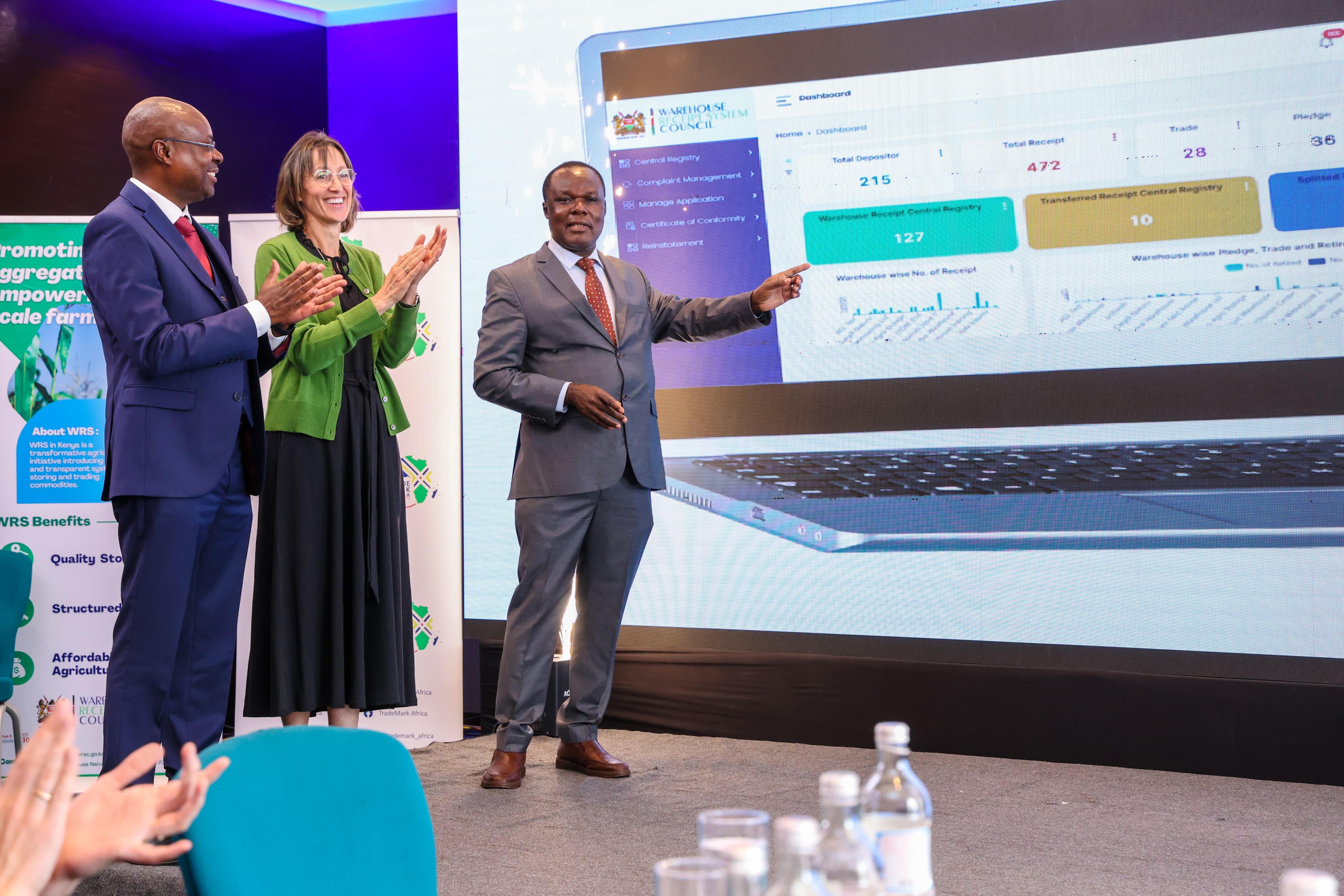 The Principal Secretary, State Department for Industry, Dr.Juma Mukhwana (far right) Deputy High Commissioner and Development Director British High Commission in Kenya Diana Dalton (middle) and WRSC Chairman Patrick Mbogo during the launch of the eWRS-CR in Nairobi.