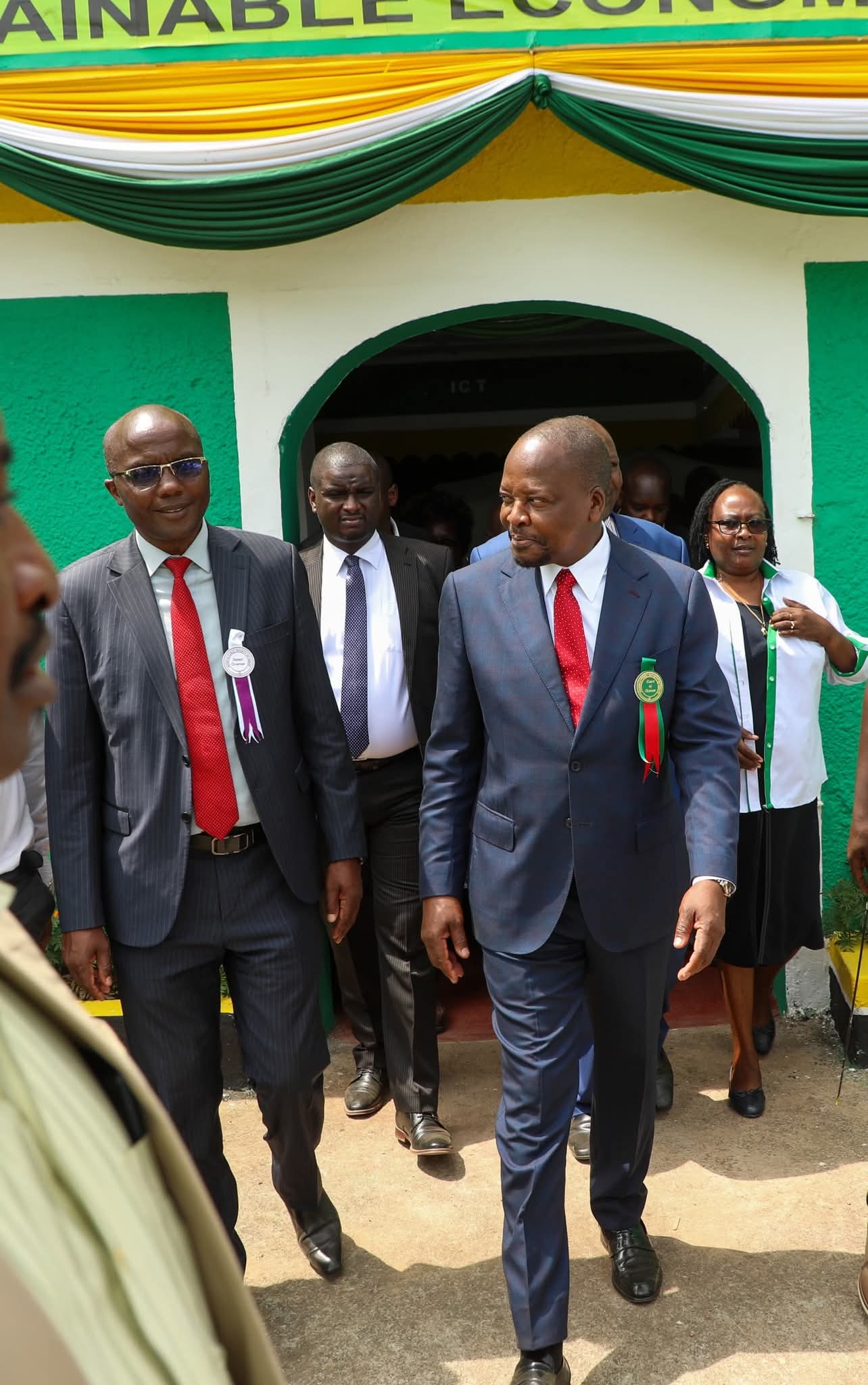 CS Mutahi Kagwe (right) is taken round the Nakuru Show by Nakuru Deputy Governor Dr David Kones (left)