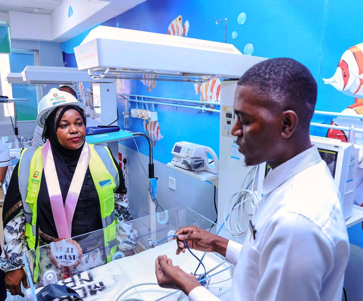 Kwale Governor Fatuma Achani cuts the ribbon during the commissioning of the newborn critical care units at the Msambweni referral hospital. 