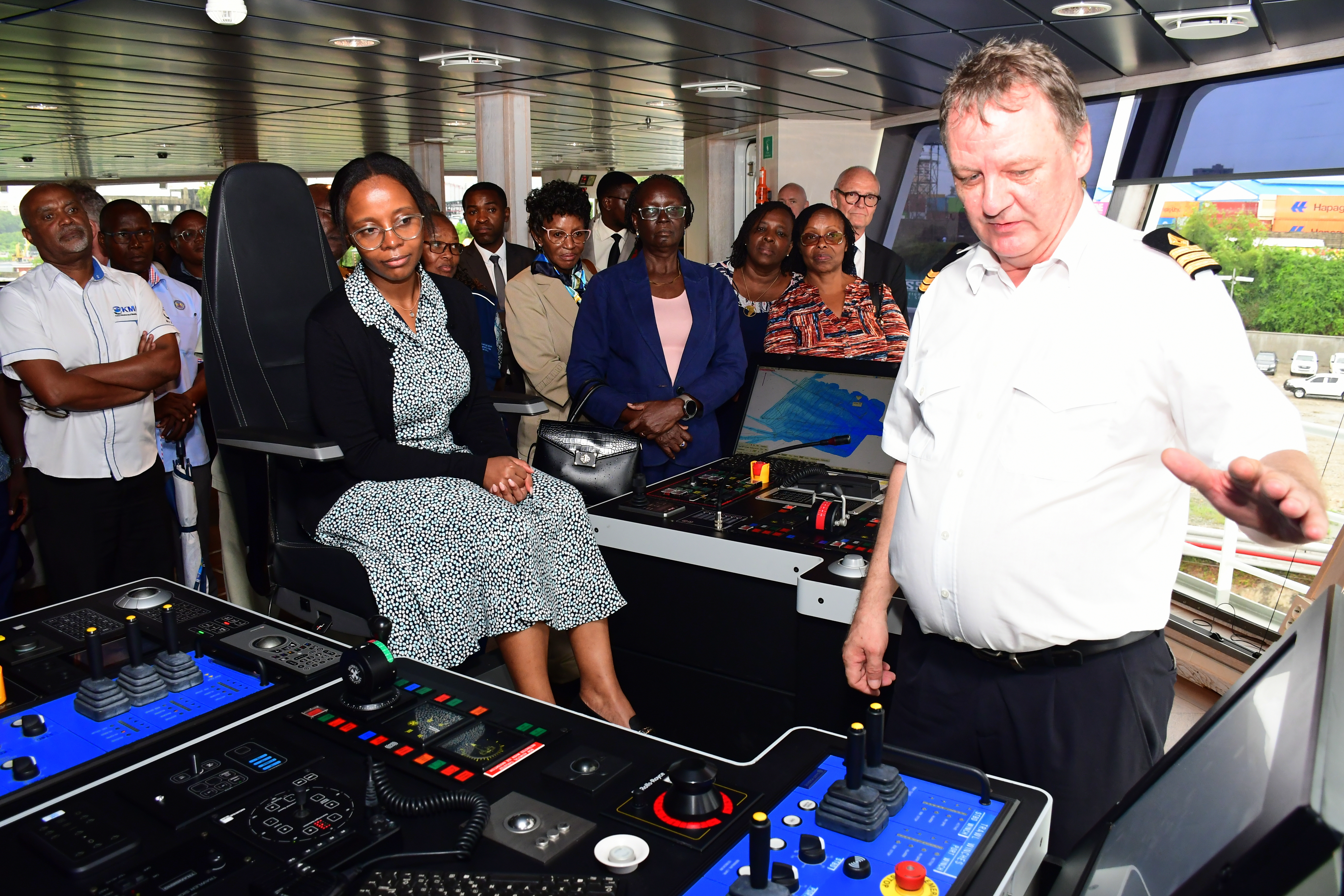Principal Secretary (PS) for Blue Economy Betsy Njagi (seated) is taken through a brief aboard Dr. Fridtjof Nansen’s research marine vessel when it docked at the Mbaraki Wharf, Mombasa. 