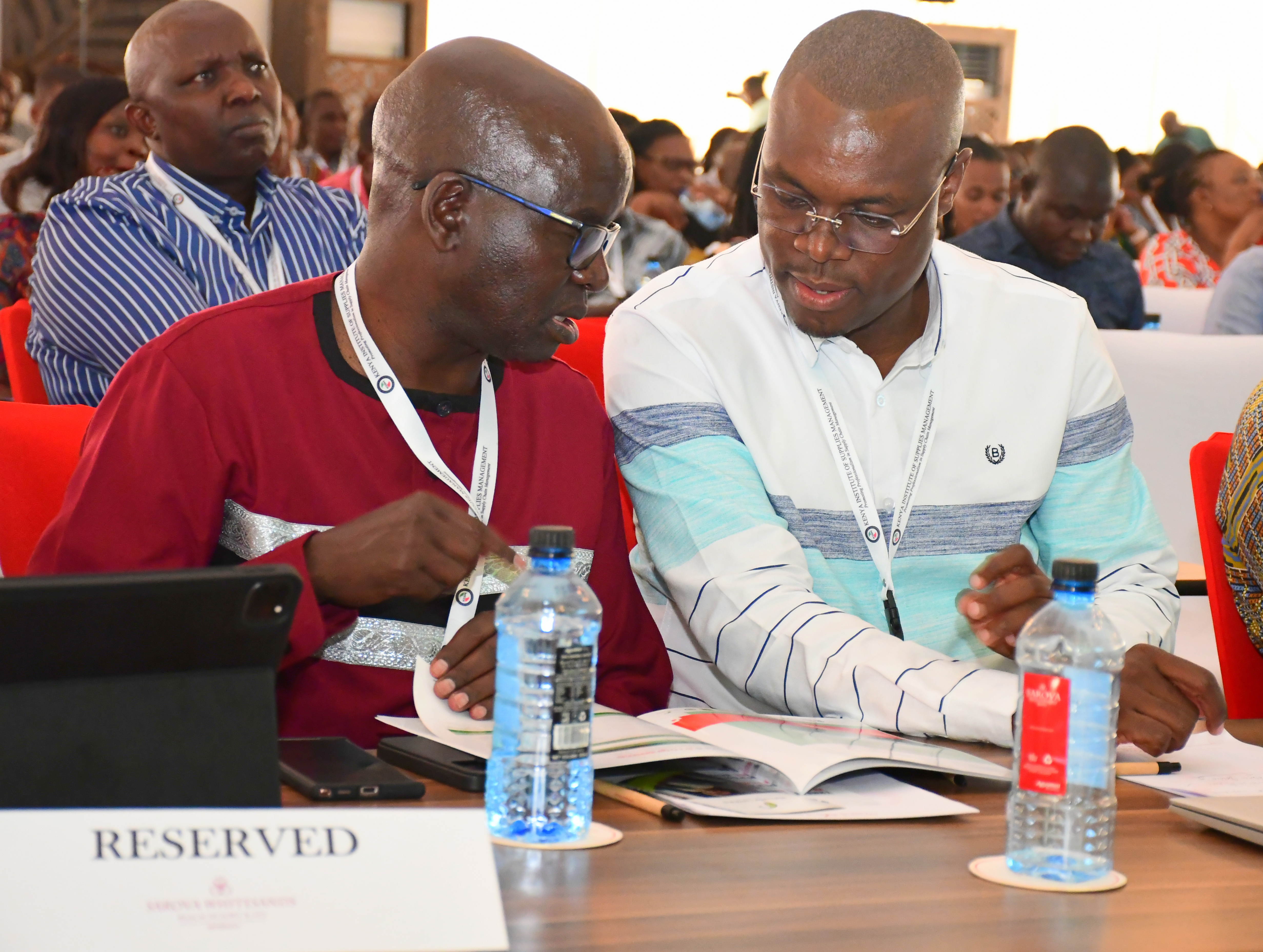 Kenya Institute of Supplies Management (KISM) leadership Chief Executive Officer (CEO) Kenneth Matiba (R) and Council Chairperson John Karani consult during the 3rd KISM National Dialogue in Mombasa. Photo/Andrew Hinga
