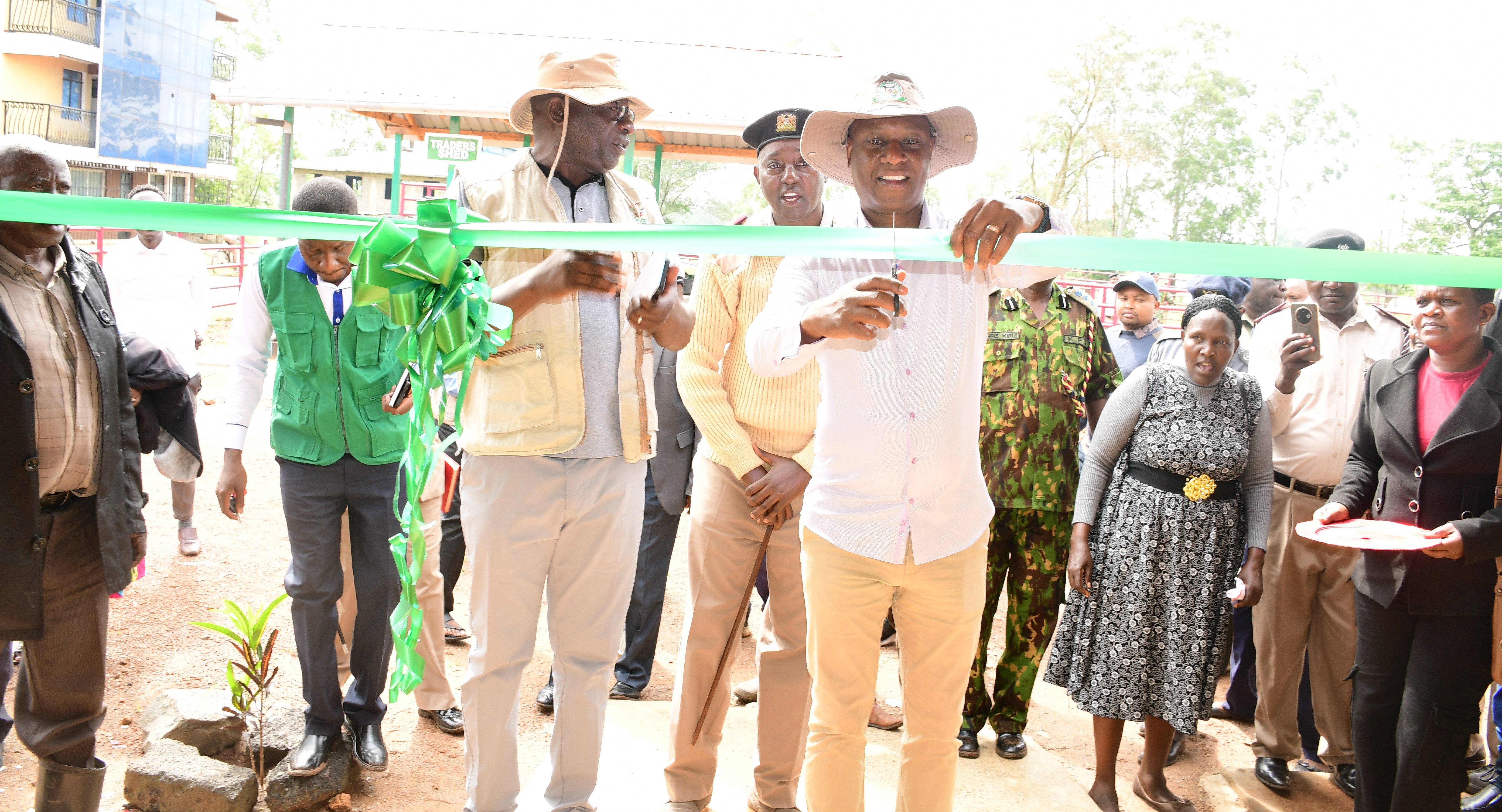 PS livestock production Jonathan Mueke cutting the ribbon as he officially opens Nambale livestock sale yard in Nambale Sub County, Busia County 