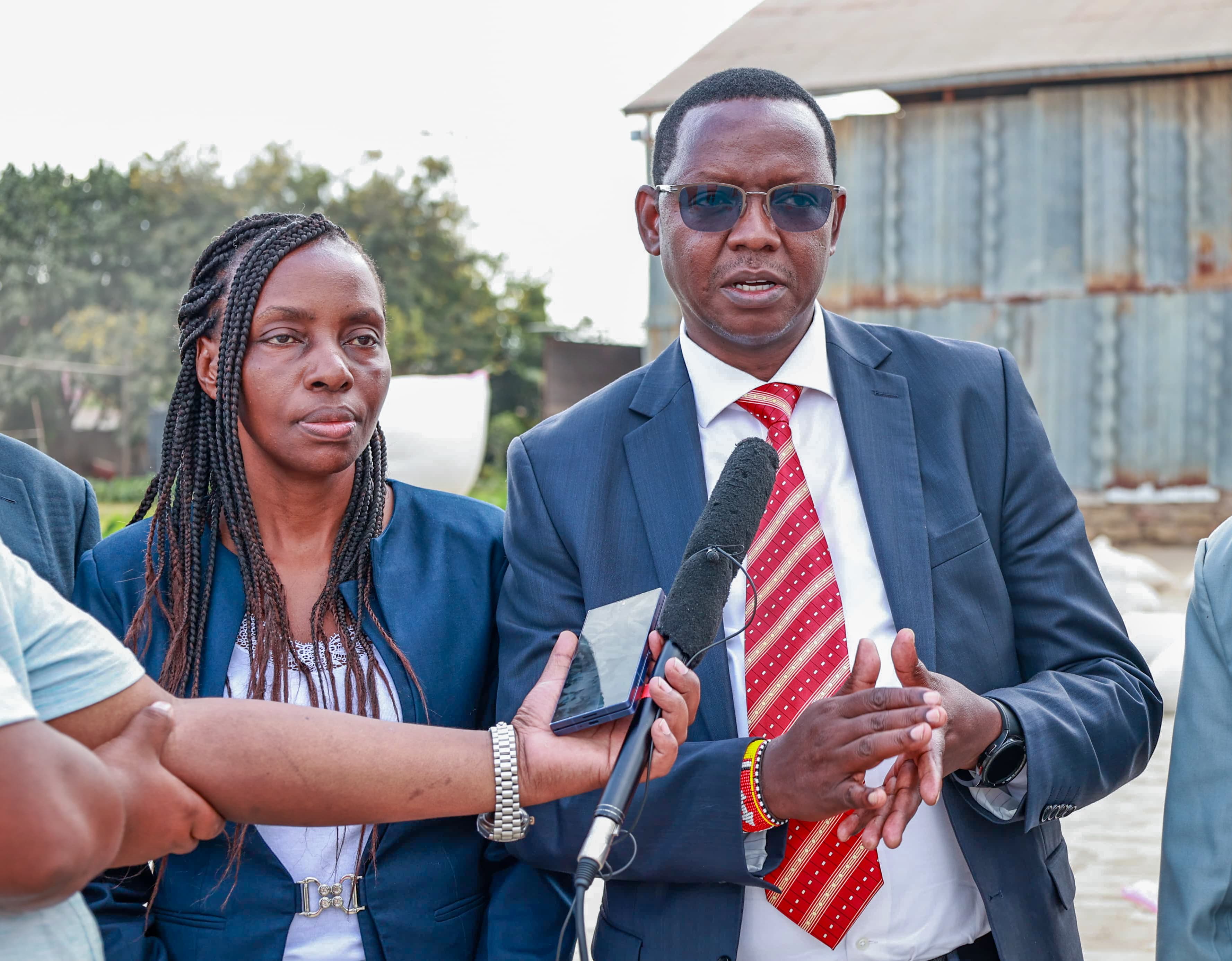 Officials from Ministry of Agriculture inside one of the rice stores in Mwea, Kirinyaga County.