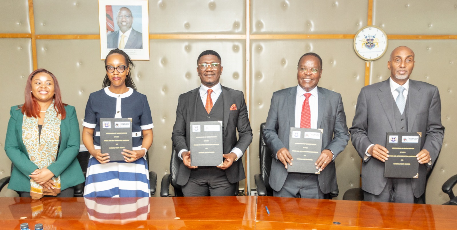 The National Youth Council Acting CEO Ms Gloria Wawira, KEPSA Youth Sector Chairperson Ms Carolyne Warui,  Youth Affairs and Creative Economy PS Mr.. Fikirini Jacobs the EACC Chairman Dr. David Oginde  and EACC Secretary/CEO Abdi Mohamud display the MOU signed between the EACC and the National Youth Council.