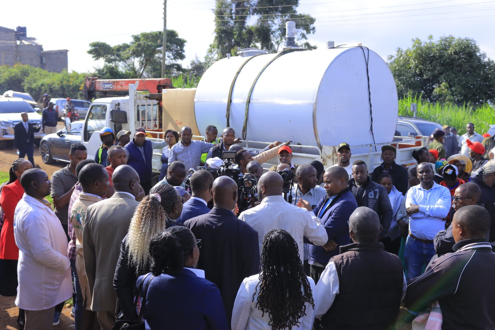 Livestock Development Principal Secretary, Jonathan Mueke, at Ndarugu Dairy Cooperative Society in Gatundu South Sub-county during the delivery of a 5,000 litres milk cooler 