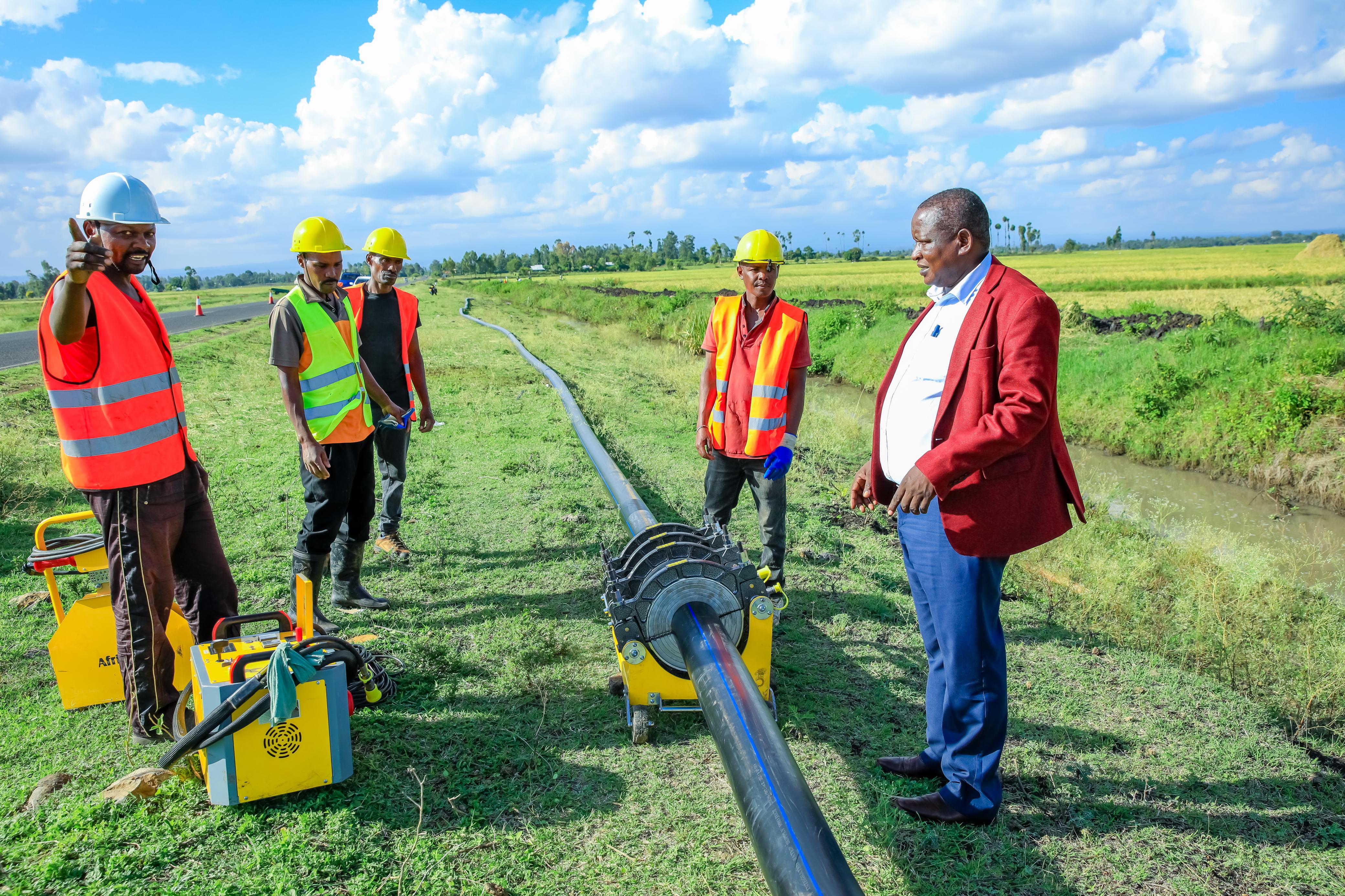 County Executive Committee (CEC) Member for Environment, Energy, Climate Change, Natural Resources, Water and Irrigation, James Mutugi, inspecting the ongoing project.
