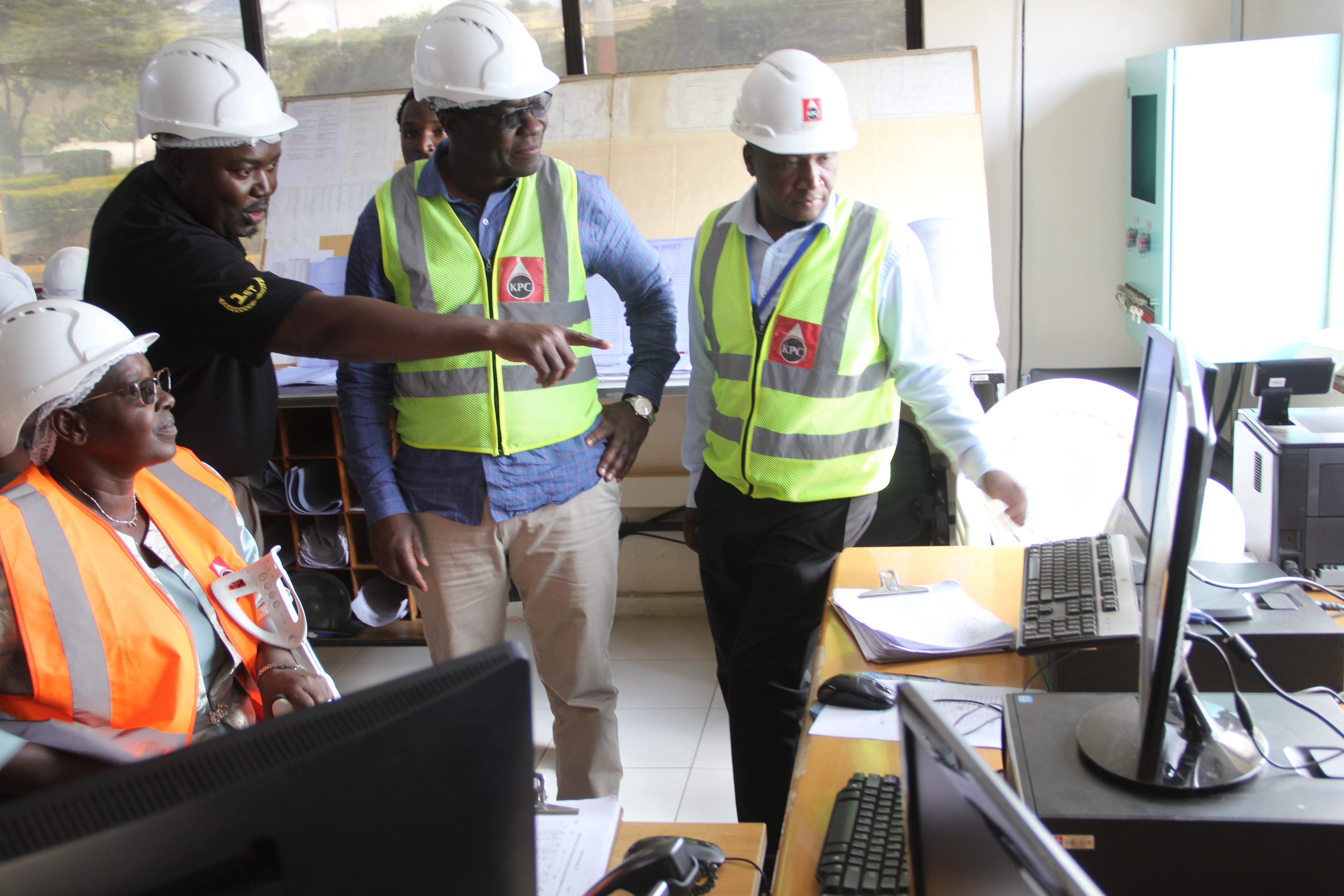 The Kenya Pipeline Company General Manager Eng. Okova Wangaki (in black) briefed the Energy and Petroleum Cabinet Secretary Opiyo Wandayi (2nd right) on the ongoing operations at the Eldoret KPC Depot control room. Photo/ Ekuwam Sylvester