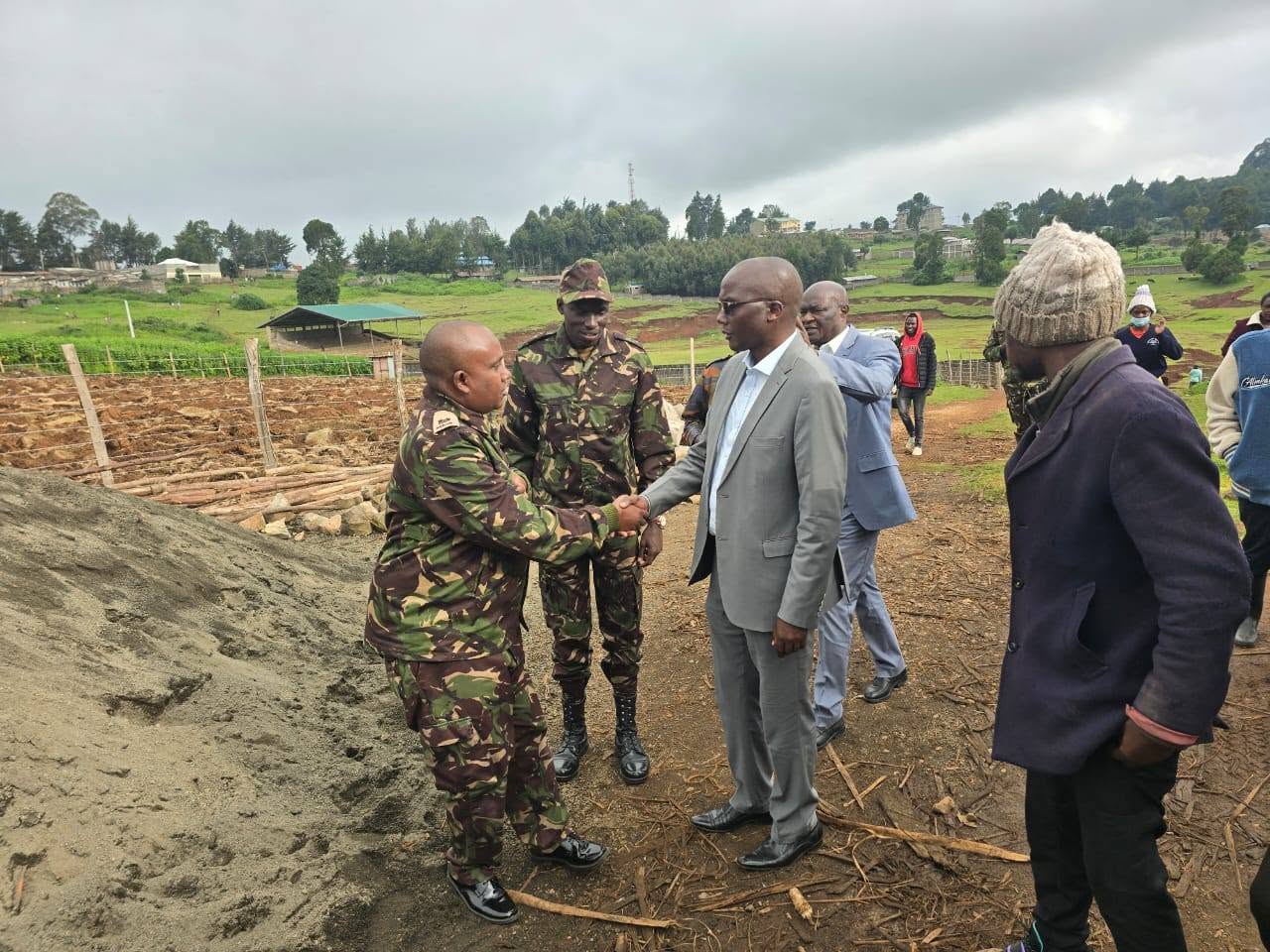 Nakuru Deputy Governor David Kones (Right) welcomes Major DG Roba of Kenya Defense Forces) who led military engineers, quantity surveyors and architects on site assessments of the stalled Olenguruone Stadium project prior to formally taking completion of the facility.