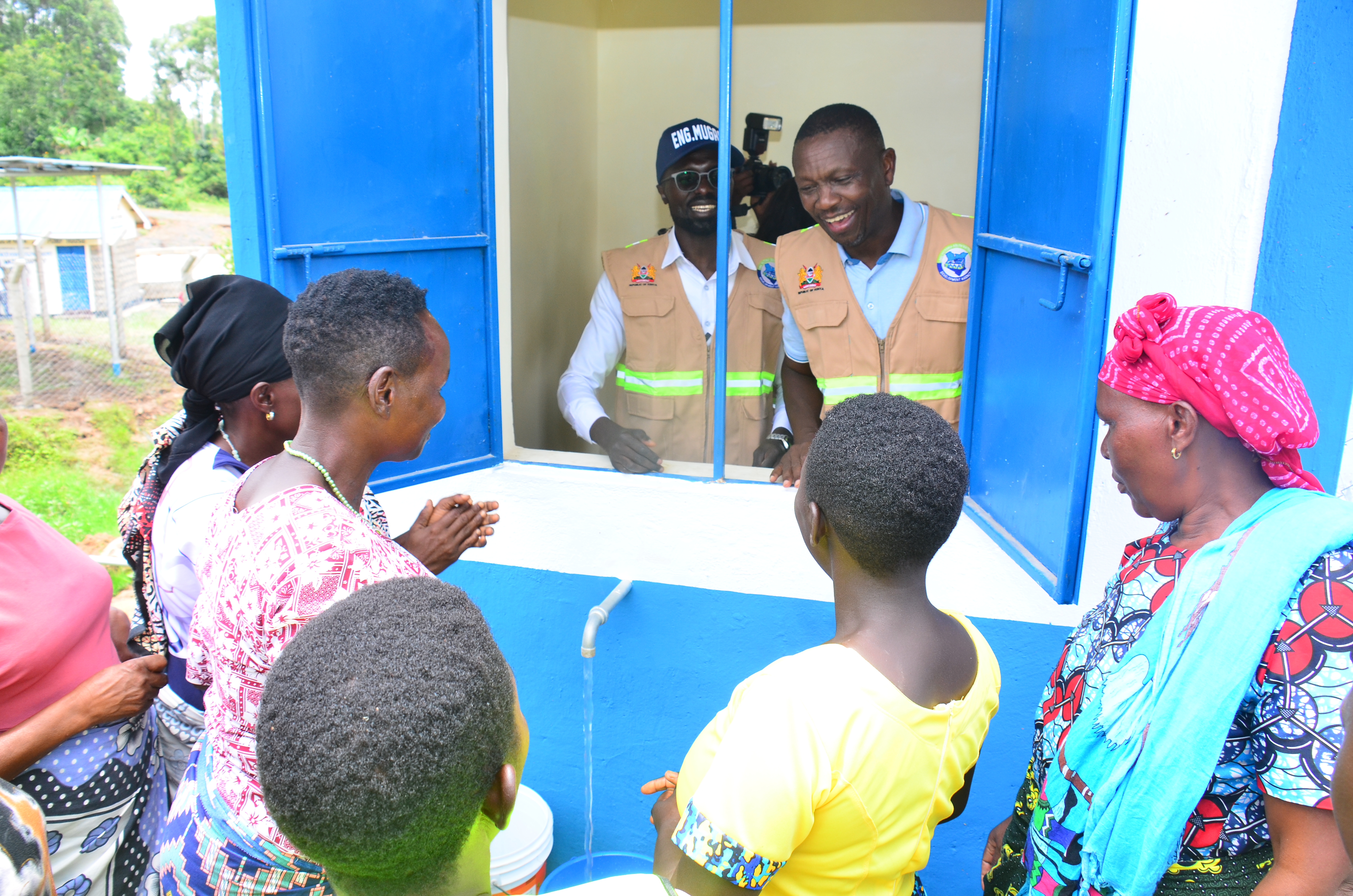 Engineer Mugaa (in cap) and Kuria East Member of Parliament Maisori Kitayama during the Commissioning of a water kiosk at the Kegango Cluster water and Sanitation project ( lot 1-Nyamanche water supply) in Kuria East Sub-County. PHOTOS: MAKOKHA KHAOYA
