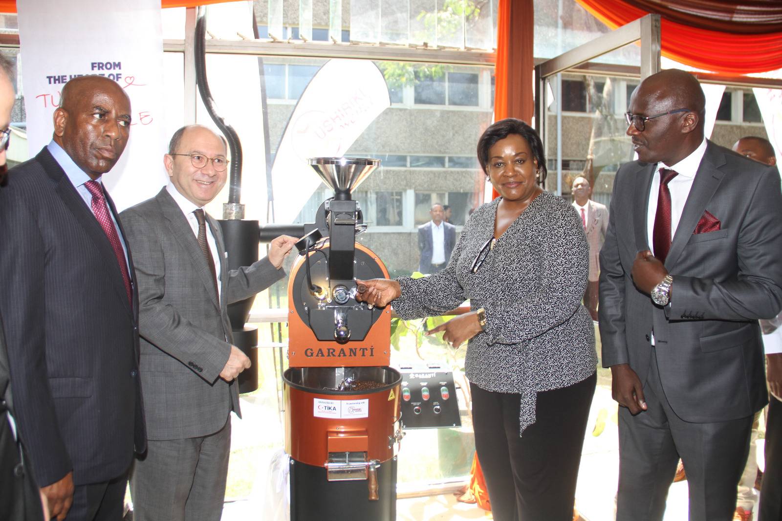 Turkish Ambassador Subutay Yuksel (2nd left) poses with officials during the handover of barista machines at Kenya Utalii College.
