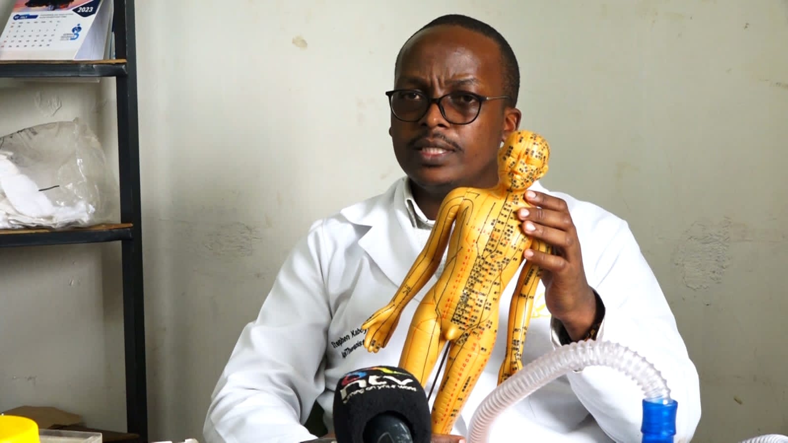 Steven Kimani explaining the 13 acupuncture points used in apitherapy during the interview