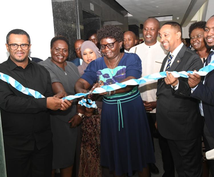 East African Community Affairs (EAC), the ASALs and Regional Development, Cabinet Secretary Beatrice Moe (center) cuts a tape at Hazina Towers Nairobi during the official handing over of new offices for East African Legislative Assembly (EALA) members, Kenya Chapter. Photos/ Bonface Malinda