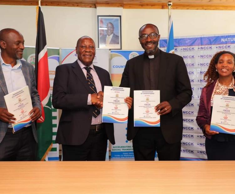 Kitui governor Dr Julius Malombe and head of NCCK display signed