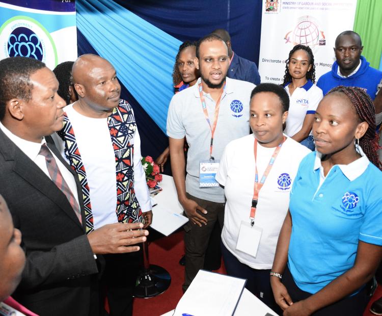 Labour and social Protection CS Dr.Alfred Mutua accompanied by his Labour and Skills Development PS Shadrack Mwadime visiting one of the exhibition booths during the Germany job exhibition  and conference at Sarit Center.