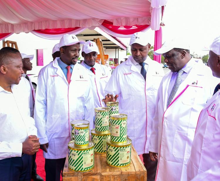 Cooperatives and MSMEs CS Wycliffe Oparanya (2nd left) and his PS Patrick Kilemi (centre) looking at some of the products manufactured by the New KCC.