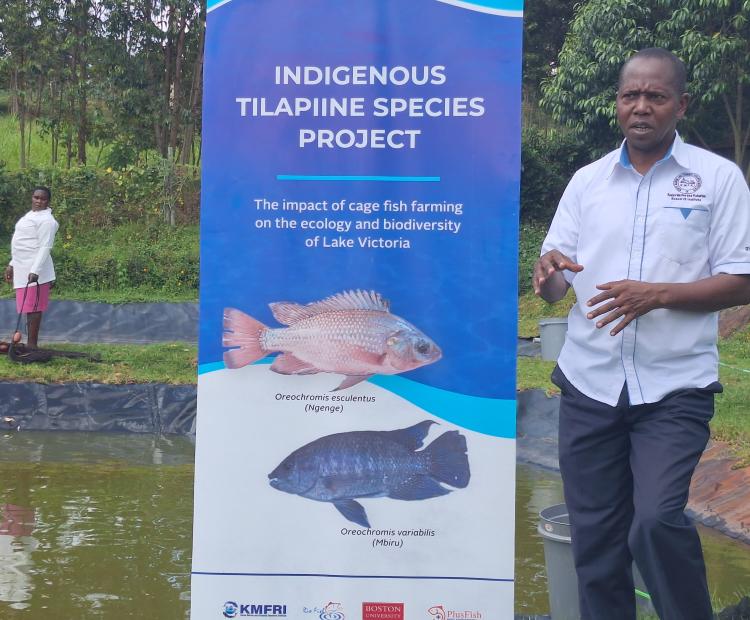 Kenya Marine and Fisheries Research Institute Assistant  Director Aquaculture Dr Paul Orina explaining about fish  species at Kegati Centre in Kisii Central Sub County