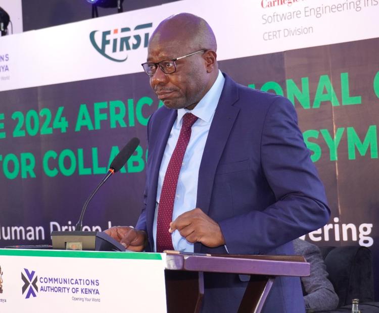 The Principal Secretary, Broadcasting and Telecommunications, Prof. Edward Kisiang’ani, speaking during the annual 2024 Africa Regional Cyber Sector Collaboration Symposium held in Nairobi. Photo/Austin Otieno.