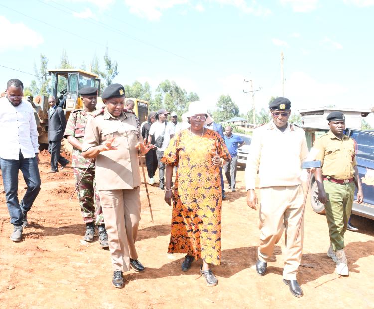 Principal Administrative Secretary at the office of the Prime Cabinet secretary, Ms. Juliana Yiapan (middle in hat) Inspecting completion status of an in-patient block of Keroka.