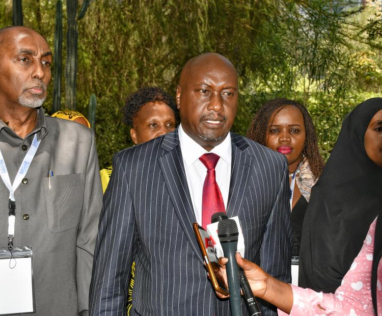 rincipal Secretary (PS) in the State Department for Public Service PS Amos Njoroge Gathecha (Centre in a striped suit) addressing the press in Naivasha during the  28th Annual national Human Resource Management (HRM) conference