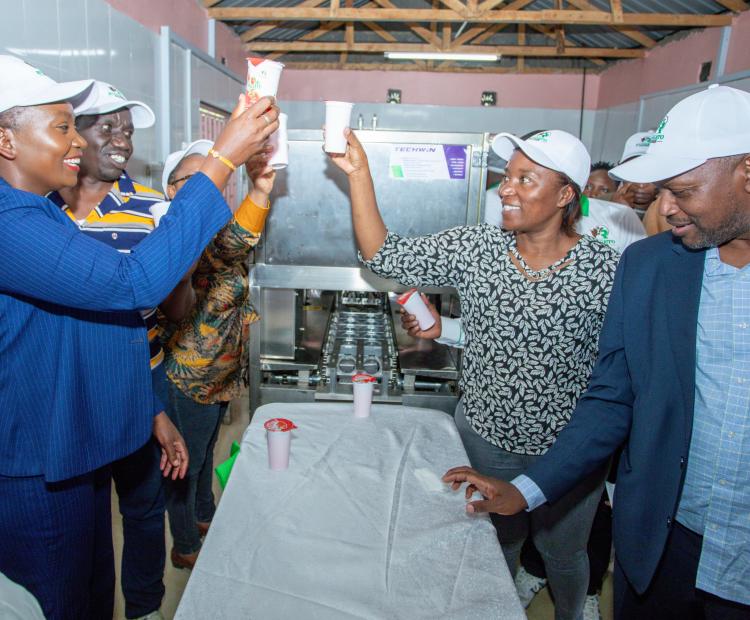 County Executive Committee member (CECM) for Finance and Economic Planning Jackline Njogu together with County Executive Committee Member (CECM) for Agriculture, Livestock, Veterinary and Fisheries Dr. John Gachara celebrating Runto yogurt at Rungeto farmers’ cooperative.