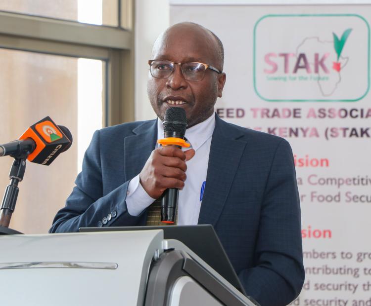 Deputy Director-Crop Resources Management Leonard Kubok reading a speech on behalf of the Agriculture and Livestock Development Cabinet Secretary (CS) Dr. Andrew Karanja during the 12th Seed Trade Association of Kenya (STAK) Congress and Seed Expo