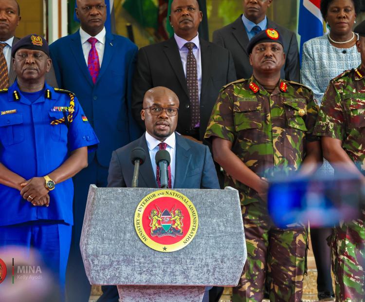 Internal Security and National Administration Principal Secretary Raymond Omollo flanked by senior security officials during a press briefing.