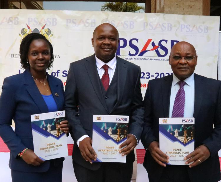 Mr Jonah Wala, the Director of Accounting Standards at the  National Treasury with the PSASB Board Chairman Pius Nduati and  the Acting CEO Ms Georgina Muchai dring the launch of the PSASB  2023-2027 Strategic Plan in Nairobi.