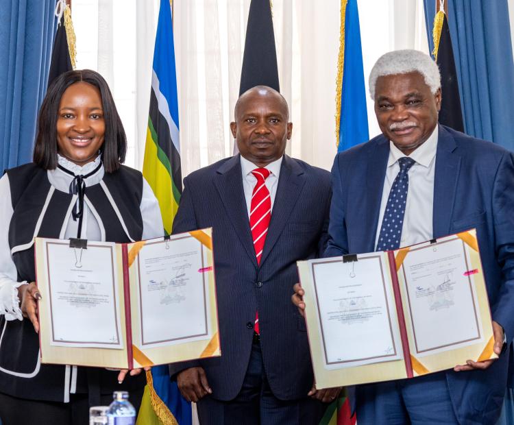 Deputy President Prof. Kithure Kindiki (center) poses with Principal Secretary for Devolution Teresia Mbaika and the UCLG Africa Secretary General, Jean-Pierre Elong Mbassi during the signing of the Hosting Agreement for the East Africa Regional Office.