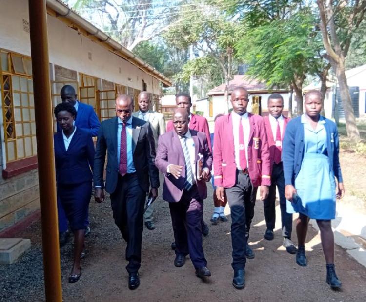 The Kenya Medical Training CEO Dr. Kelly Oluoch (red  tie) during a routine visit to KMTC Bondo campus.