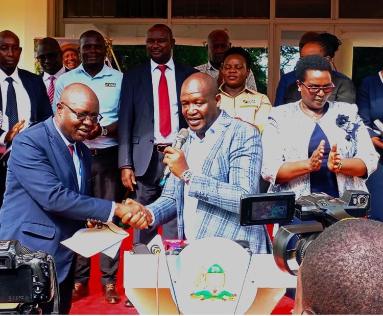 Kericho County Governor Dr. Erick Mutai Shake Hands with CGA Chairman Dr. Moses Mwenje shortly after the agreement signing