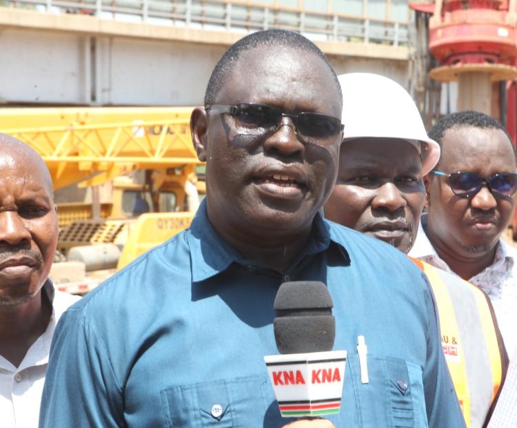 North Eastern Regional Commissioner John Otieno  addressing the press at the new Tana Bridge construc tion site during an inspection tour. 