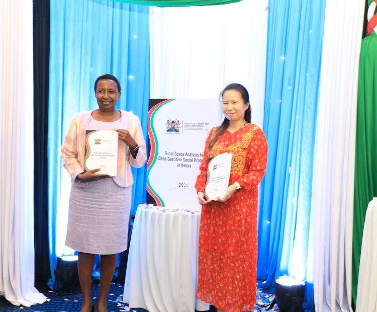 The Director, National Social Protection Secretariat, Jane Kitili (left) poses with the Fiscal Space Analysis Report booklet alongside Country Director, Save the Children International, Pornpun Jib Rabiltossaporn, during the launch of the Fiscal Space Analysis Report on Universal Child Benefit (UCB), Programme at a Nairobi Hotel.