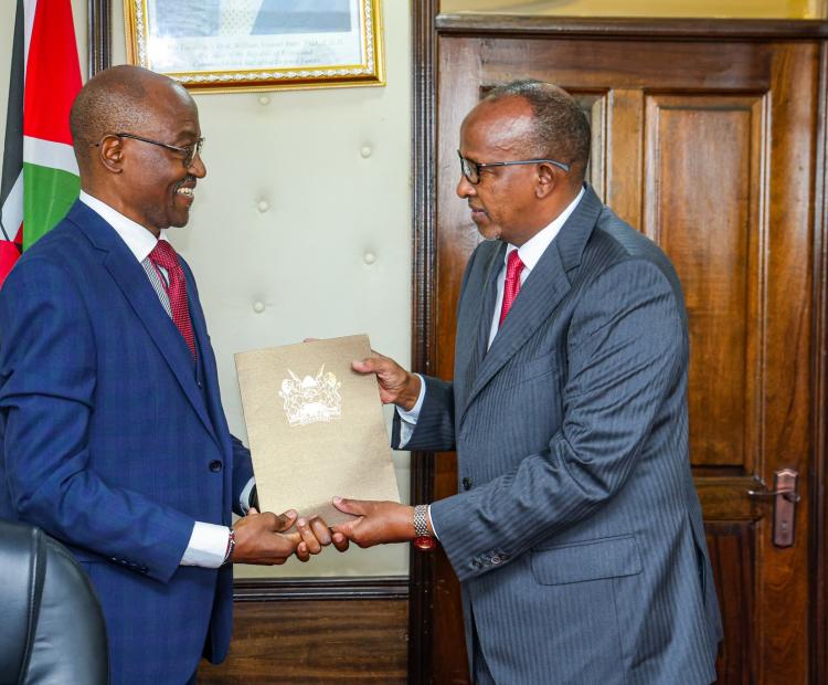 The committee chairperson, James Masiro (L) Cabinet Secretary (CS) for health Hon.Aden Duale(R) during the launch of National Health Insurance Fund (NHIF) pending claims verification committee in Nairobi Afya house