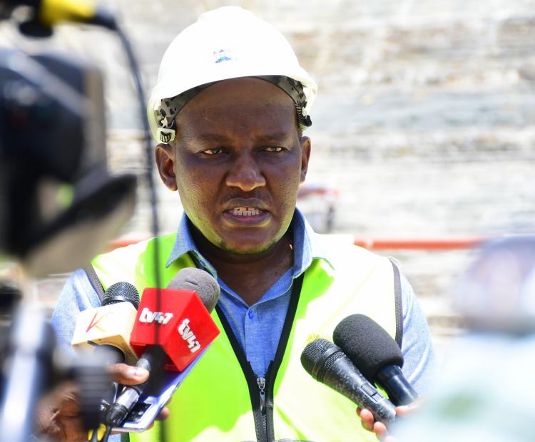 Principal Secretary  (PS) State Department  of Irrigation Ephantus  Kimotho briefs the media  during a tour of the  Mwache Multipurpose  Dam under construction  in Kinango Sub-County,  Kwale. Photo/Andrew Hinga