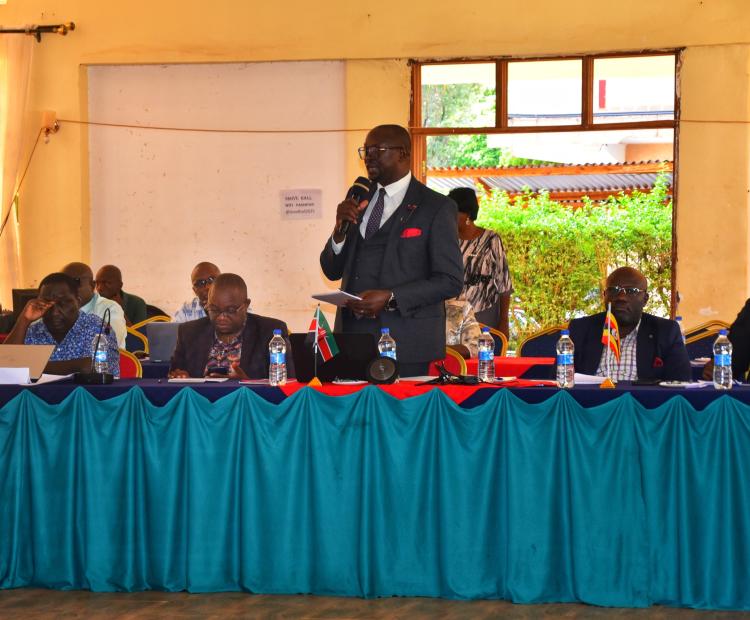Dr. Joseph Lenai, Director for Primary Health Care at the Ministry of Health, Kenya, addressing delegates during the Joint Cross-Border Malaria Control Initiative Planning Meeting held at Farm View Hotel in Bu.