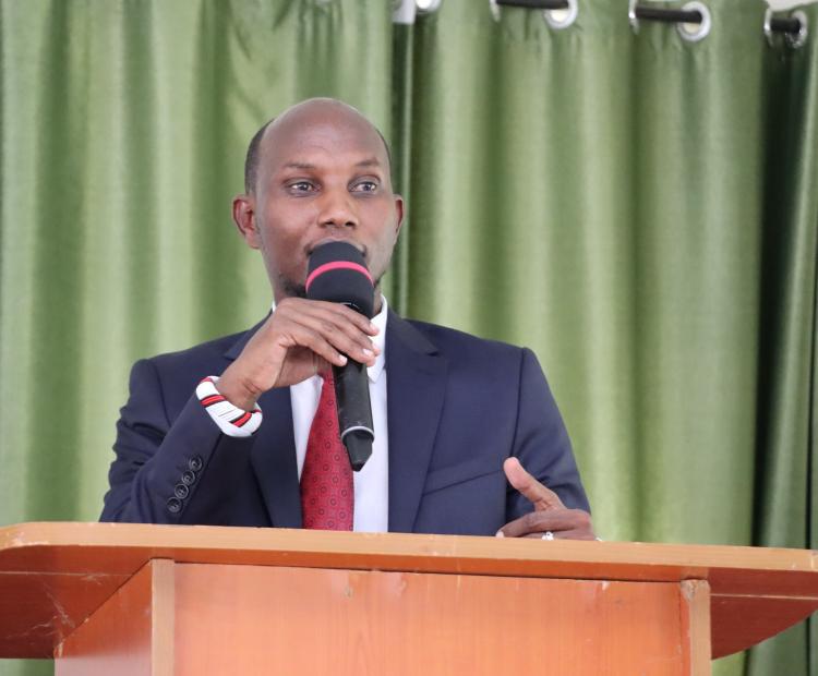 Devolution PS Michael Lenasalon addressing participants at a Trainers of Trainers (ToTs) workshop held at a hotel in Wote town.